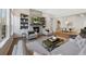 Spacious living room featuring a fireplace, built-in shelving, and comfortable seating at 13633 Mariposa St, Broomfield, CO 80023