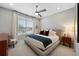 Serene main bedroom featuring a ceiling fan, large window, and comfortable furnishings at 13633 Mariposa St, Broomfield, CO 80023