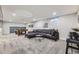 This finished basement offers a comfortable lounge area with a sectional sofa and a pool table for entertainment at 8340 W 70Th Ave, Arvada, CO 80004