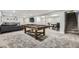 Spacious finished basement with a pool table, seating area, foosball table, and extra space for entertaining at 8340 W 70Th Ave, Arvada, CO 80004