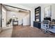 Stylish living room with hardwood floors, a built-in workstation, and comfortable seating at 27130 E Maple Ave, Aurora, CO 80018