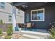 Cozy outdoor patio area with seating and a grill, perfect for relaxing and entertaining at 27130 E Maple Ave, Aurora, CO 80018