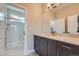 Modern bathroom featuring a dual sink vanity with quartz countertops and a separate glass shower at 307 W Charles St, Superior, CO 80027
