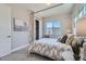 Stylish bedroom featuring a four-poster bed, closet, ample natural light, and tasteful decor at 307 W Charles St, Superior, CO 80027