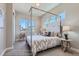 Serene bedroom with a four-poster bed, large windows, and minimalist decor for a relaxing retreat at 307 W Charles St, Superior, CO 80027