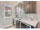 Butler's Pantry featuring custom cabinetry, a beverage fridge, and a wine refrigerator at 307 W Charles St, Superior, CO 80027