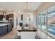 Open concept floor plan with modern chandelier and sliding glass doors to outdoor patio at 307 W Charles St, Superior, CO 80027