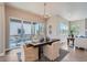Bright dining area with modern chandelier and sliding glass doors to outdoor patio at 307 W Charles St, Superior, CO 80027