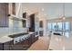 Gourmet kitchen showcasing a stainless steel appliance package, an oversized island, and a modern backsplash at 307 W Charles St, Superior, CO 80027