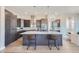 This gourmet kitchen includes an oversized island, modern backsplash, sleek countertops, and stainless steel appliances at 307 W Charles St, Superior, CO 80027