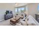 Inviting living room with ample seating, media console, and natural light at 307 W Charles St, Superior, CO 80027