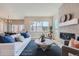 Inviting living room featuring a modern fireplace and large windows for natural light at 307 W Charles St, Superior, CO 80027