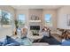 Inviting living room with natural light, decorative fireplace, comfortable chairs, and stylish furnishings at 307 W Charles St, Superior, CO 80027