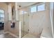 Modern shower featuring marble-like tiles, a glass enclosure, and a convenient built-in bench at 307 W Charles St, Superior, CO 80027