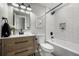 Renovated bathroom features modern vanity and subway tile shower at 7882 S Independence Way, Littleton, CO 80128