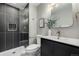 Modern bathroom with a glass-enclosed shower, stylish fixtures, and elegant tiling at 7882 S Independence Way, Littleton, CO 80128