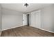 Bedroom featuring wood-look floors, a window and a closet at 7882 S Independence Way, Littleton, CO 80128