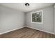 Empty bedroom with clean lines, wood flooring, and natural light from a bright window at 7882 S Independence Way, Littleton, CO 80128