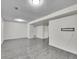 Spacious finished basement with grey laminate floors at 12644 W Virginia Ave, Lakewood, CO 80228