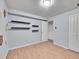 Finished basement bedroom with grey walls and floating shelves at 12644 W Virginia Ave, Lakewood, CO 80228