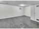 Finished basement with grey vinyl flooring and ample space at 12644 W Virginia Ave, Lakewood, CO 80228