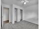 Bedroom with grey carpet, double closets and ceiling fan at 12644 W Virginia Ave, Lakewood, CO 80228