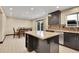 Eat-in kitchen with granite island and sliding door to patio at 12644 W Virginia Ave, Lakewood, CO 80228