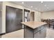 Modern kitchen with granite countertop island and dark cabinetry at 12644 W Virginia Ave, Lakewood, CO 80228