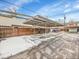 Covered carport parking area with snow on the ground at 12644 W Virginia Ave, Lakewood, CO 80228