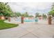 Community swimming pool with brick border and fence at 12644 W Virginia Ave, Lakewood, CO 80228