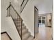 Modern staircase with metal railing leading to the upper level at 12644 W Virginia Ave, Lakewood, CO 80228