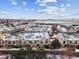 Beautiful aerial view of townhomes with balconies and attached garages, covered in fresh snow, on a sunny day at 1861 Mallard Dr, Superior, CO 80027