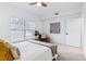 Inviting bedroom offers natural light, a ceiling fan, and an inviting chair by the window at 1861 Mallard Dr, Superior, CO 80027