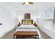 Bedroom featuring a ceiling fan, a window, neutral decor, and comfortable furnishings at 1861 Mallard Dr, Superior, CO 80027