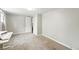 This bedroom features neutral paint and carpet with a large closet at 1155 N Ash St # 102, Denver, CO 80220