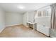 This bedroom features neutral paint and carpet with a large window for natural light at 1155 N Ash St # 102, Denver, CO 80220