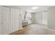This bedroom features neutral paint and carpet with a large closet at 1155 N Ash St # 102, Denver, CO 80220