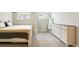 Bedroom features neutral paint, carpet, and includes a large dresser with mirror at 1155 N Ash St # 102, Denver, CO 80220