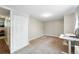 This bedroom features neutral paint and carpet with a large closet at 1155 N Ash St # 102, Denver, CO 80220