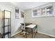 Home office with industrial desk, desk chair, and natural light creating an efficient workspace at 1155 N Ash St # 102, Denver, CO 80220