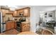 A modern kitchen with stainless steel appliances transitions into a compact, functional office space at 1155 N Ash St # 102, Denver, CO 80220