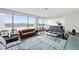 Bright living room with large windows offering beautiful city views at 1155 N Ash St # 102, Denver, CO 80220