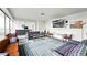 A spacious living room with floor to ceiling windows with bar and plenty of seating at 1155 N Ash St # 102, Denver, CO 80220