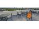 Outdoor rooftop deck with seating offers panoramic views of the city skyline at 1155 N Ash St # 102, Denver, CO 80220
