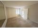 This carpeted bedroom features a large window for natural light and an air conditioning unit at 14751 E Tennessee Dr # 213, Aurora, CO 80012