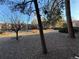 Landscaped courtyard with trees and gravel groundcover, offering a peaceful outdoor setting at 14751 E Tennessee Dr # 213, Aurora, CO 80012