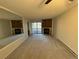 Open living room showcasing a fireplace with an adjacent sliding glass door to balcony at 14751 E Tennessee Dr # 213, Aurora, CO 80012