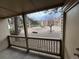 Covered patio provides views of the courtyard with mature trees and gravel groundcover at 14751 E Tennessee Dr # 213, Aurora, CO 80012