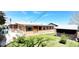 Well-maintained backyard with lush green grass and shade at 8338 Charles Way, Denver, CO 80221