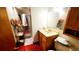 Bathroom with red tile flooring and a glass-enclosed shower at 8338 Charles Way, Denver, CO 80221